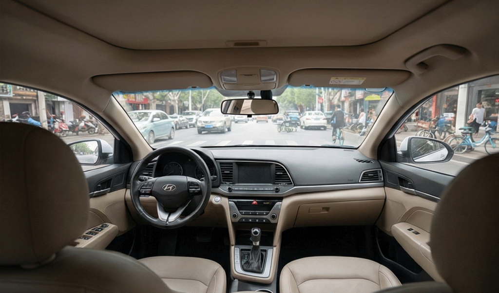 iew through the windshield of a driverless car navigating heavy traffic in Wuhan.