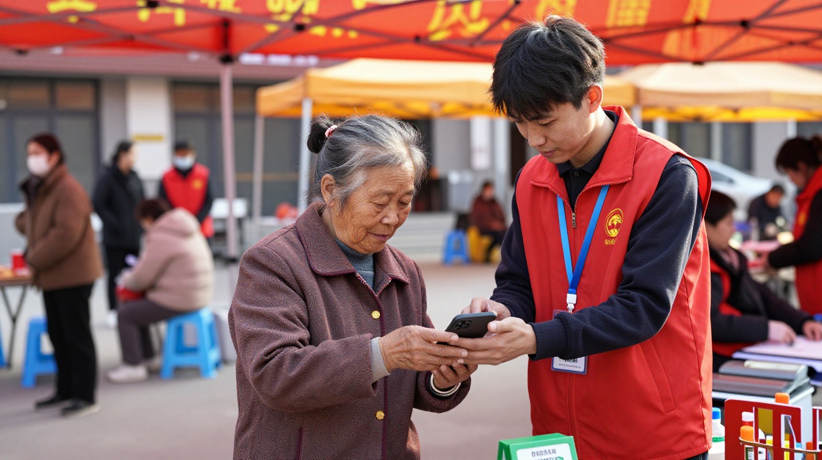 A young volunteer helping an elderly woman learn how to use QR codes for payments in China