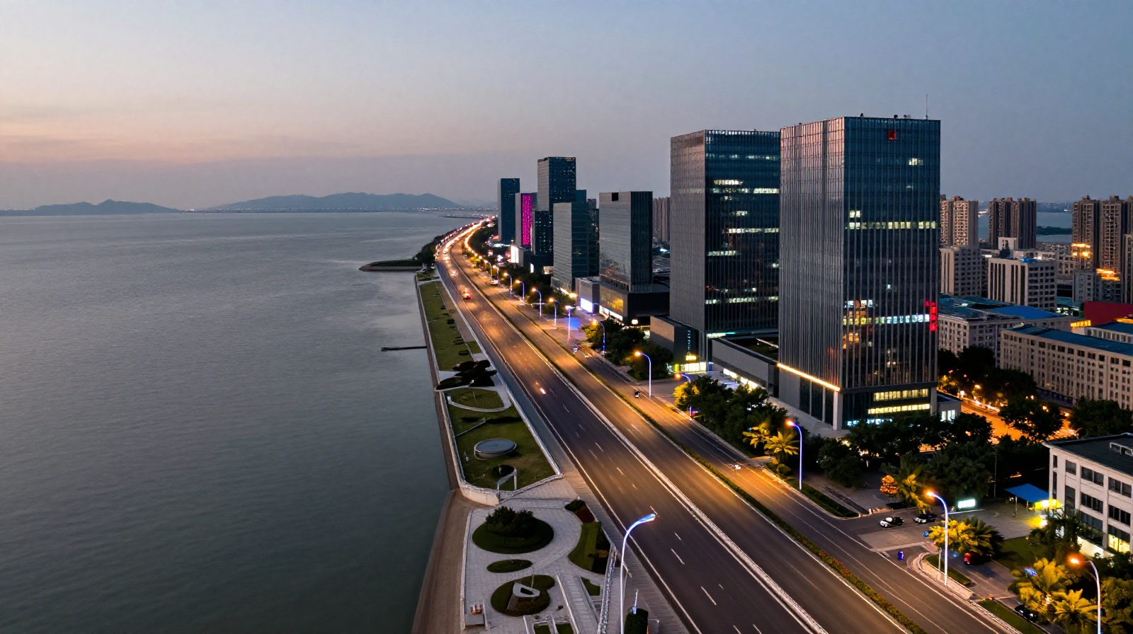 Dusk view of the futuristic Binhai Coastal Highway with glass skyscrapers and the Bohai Sea