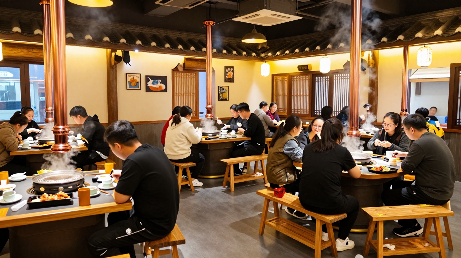 Locals enjoying a family-style Korean BBQ dinner at a bustling restaurant in Yanji with sizzling meat on the table