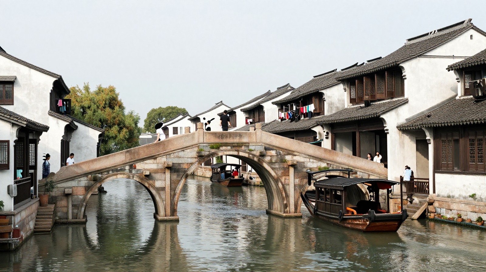 The famous Double Bridge in Zhouzhuang water town with traditional houses and daily life activities