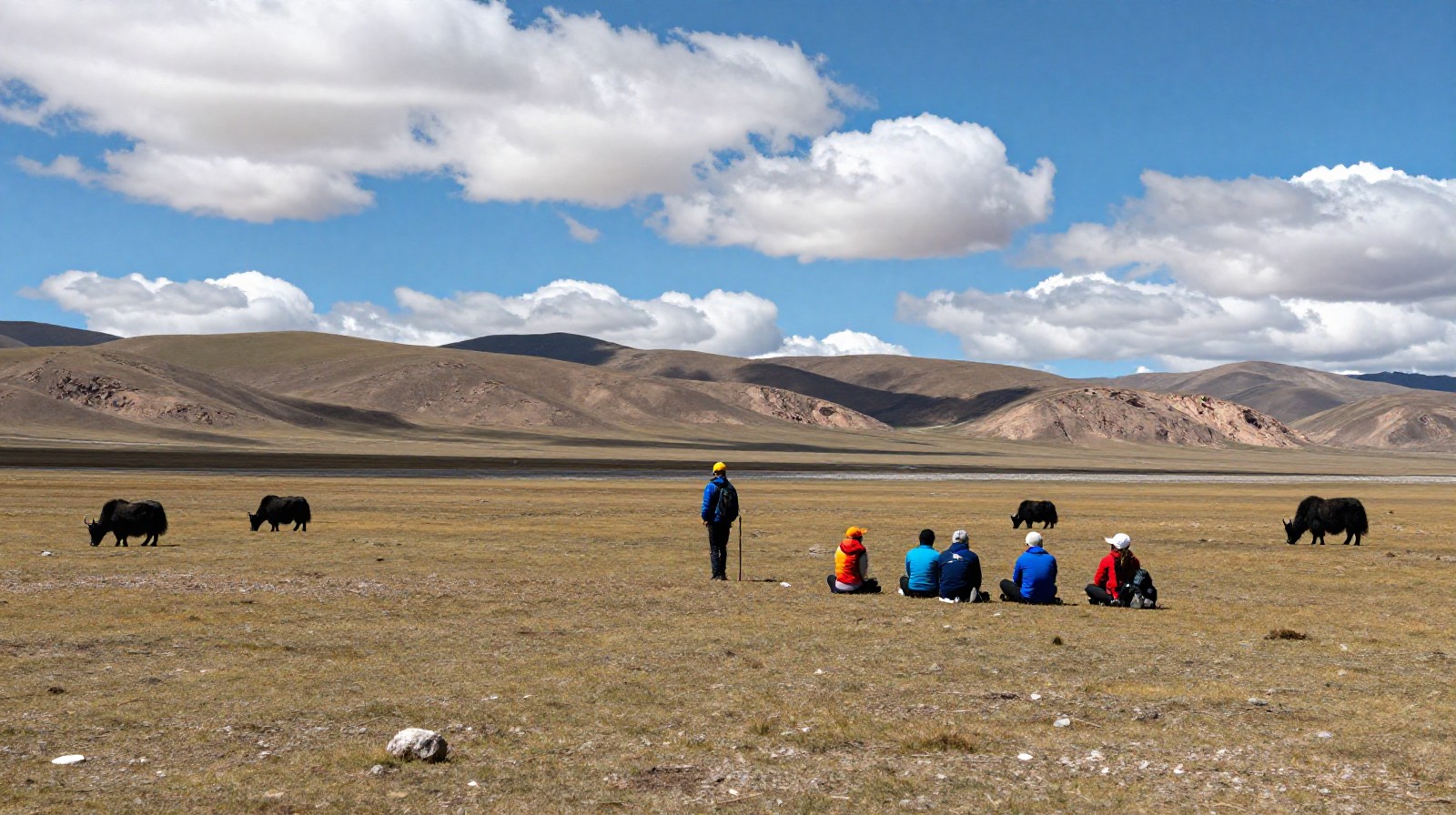Hikers taking a break on the high-altitude Tibetan plateau near Jiuzhaigou