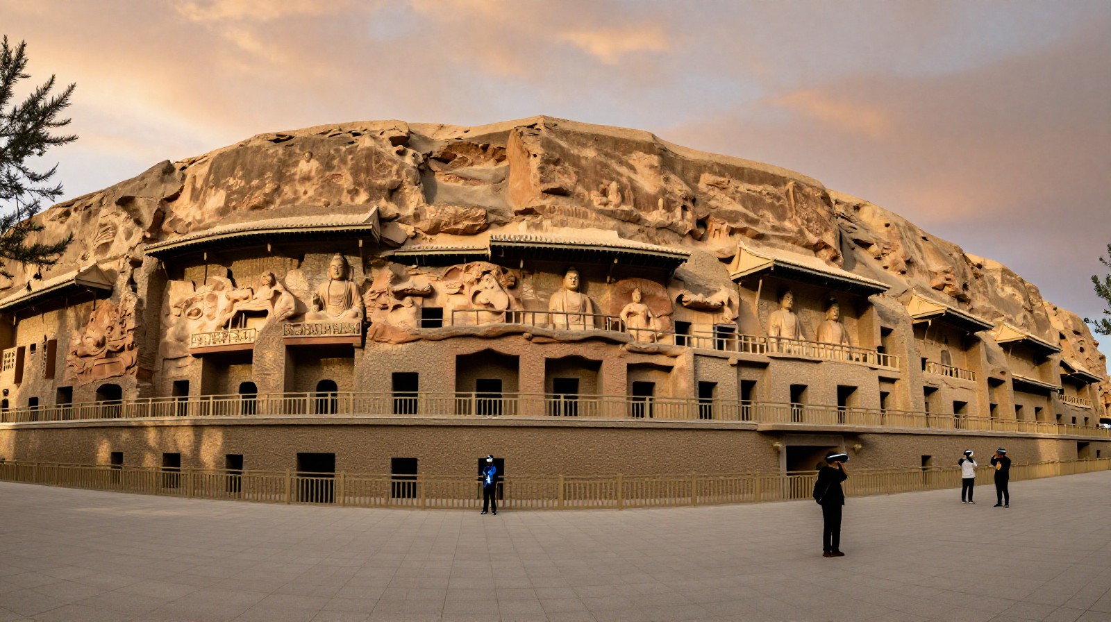 Tourists exploring the historic Mogao Caves in Dunhuang using virtual reality technology under the warm glow of sunset