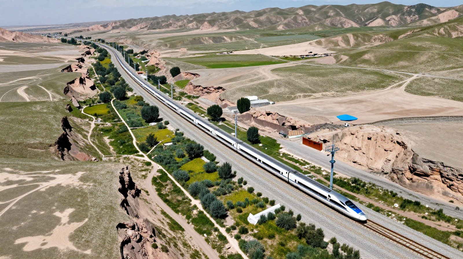 High-speed train traveling through a green oasis in Gansu, connecting remote areas with modern transportation networks