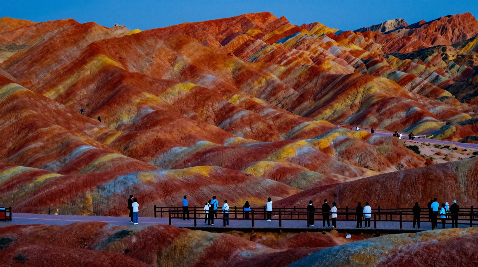Tourists observing the sunset colors on Zhangye Danxia rock formations