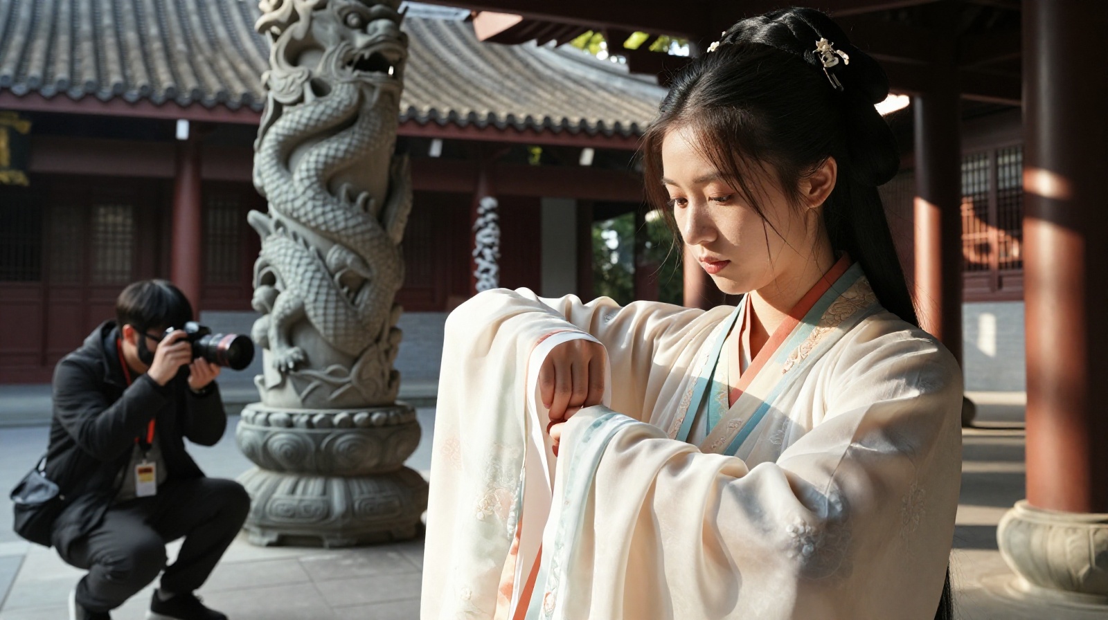 Young Chinese person wearing colorful Hanfu traditional clothing adjusting their sleeve inside an ancient temple courtyard with stone carvings in the background