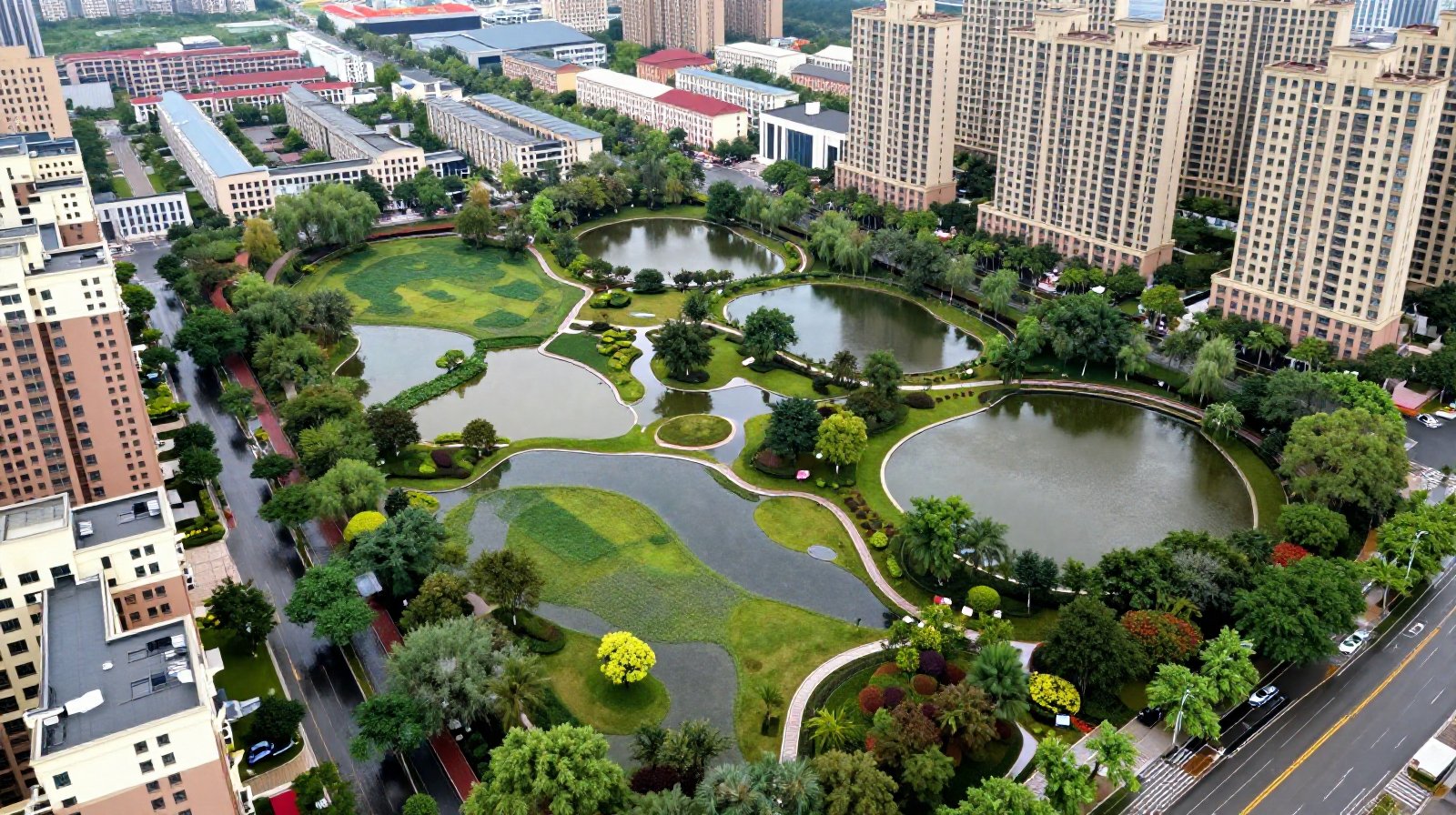 Aerial perspective of sunken green spaces and retention basins in a Chinese Sponge City pilot area managing floodwater