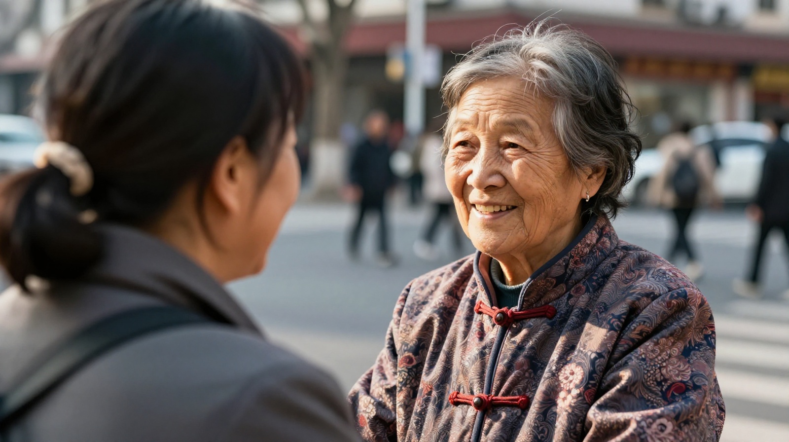 An elderly Chinese neighbor smiling and saying 'Have you eaten?' to a passerby on a sunny city street in Shanghai