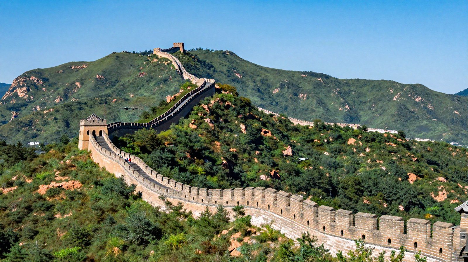 Drone flying alongside the Great Wall in the mountains