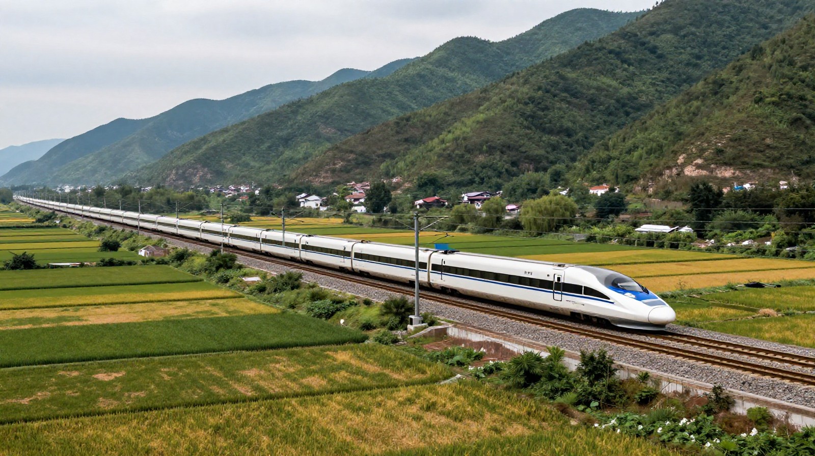 A high-speed train traveling through the scenic mountainous landscape of Sichuan province.