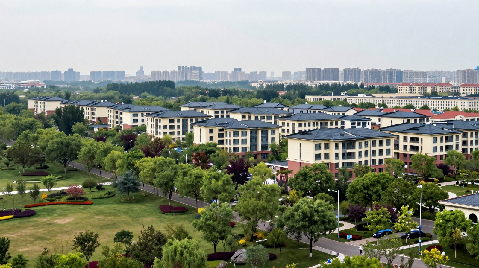 Peaceful residential neighborhood in a Chinese satellite town with modern apartments and green spaces near a distant city skyline