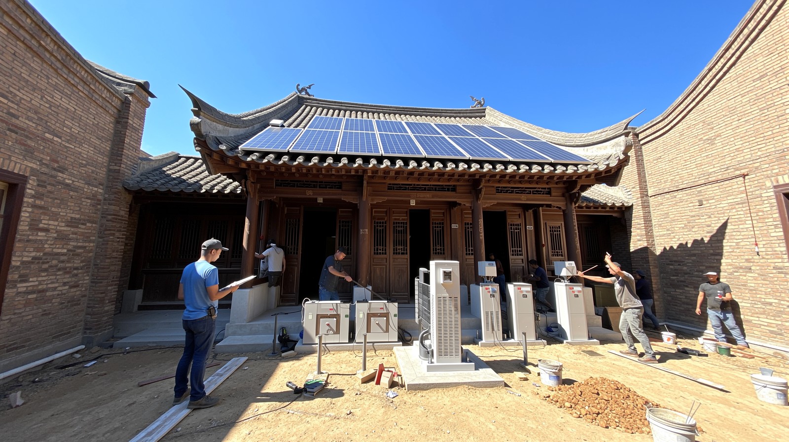 Workers installing renewable energy equipment in a traditional Beijing Hutong neighborhood.