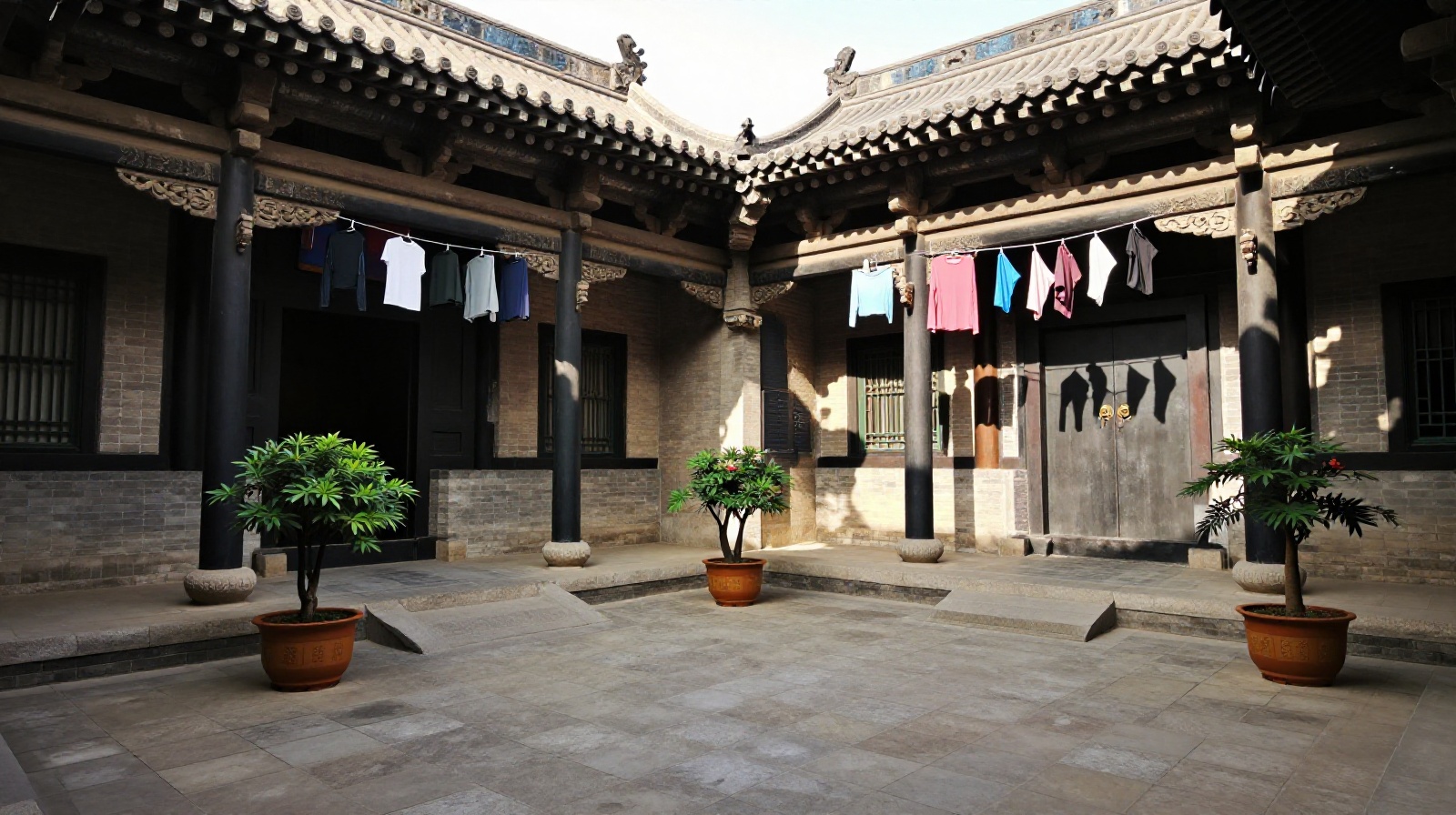 A quiet traditional Chinese courtyard in Shaanxi featuring potted orchids and laundry hanging under deep wooden eaves, showcasing the inward-focused architecture design.