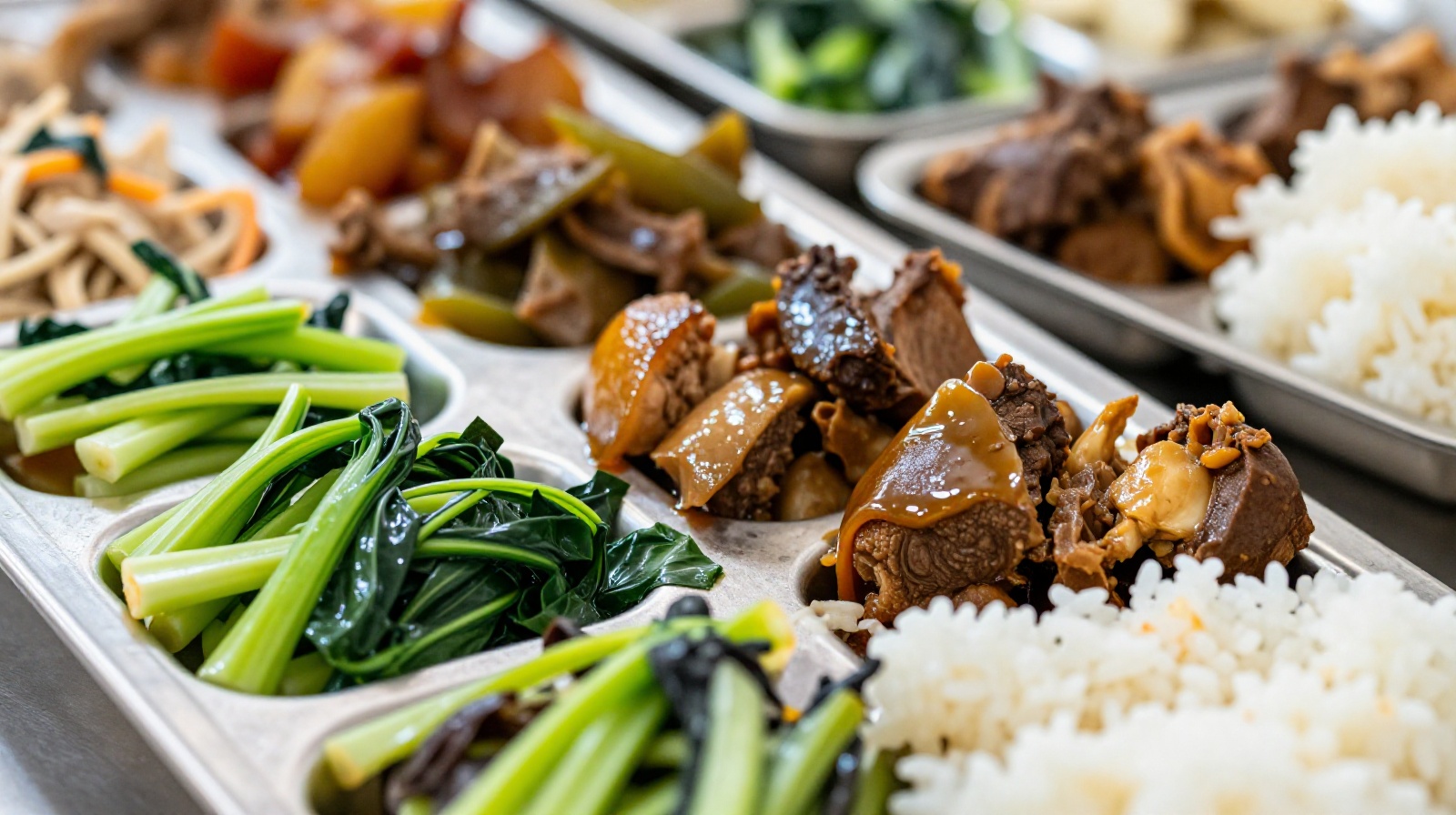 Close-up of a varied menu tray in a Chinese community canteen, showing affordable dishes like steamed vegetables, braised meat, and rice, highlighting the economic value and healthy food options.