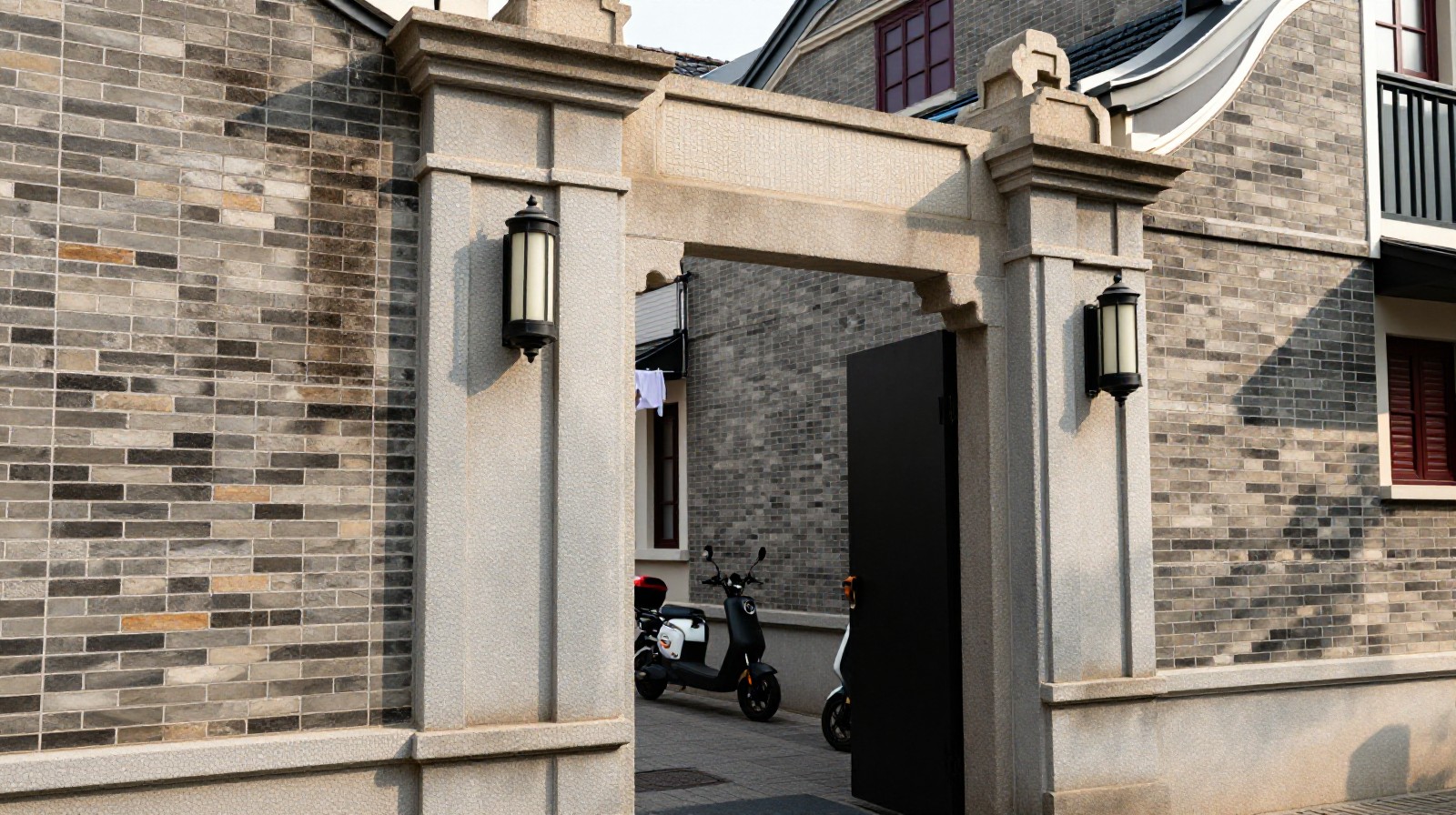 Detailed view of traditional Shanghai Shikumen stone gateposts and brick buildings in a lilong alley