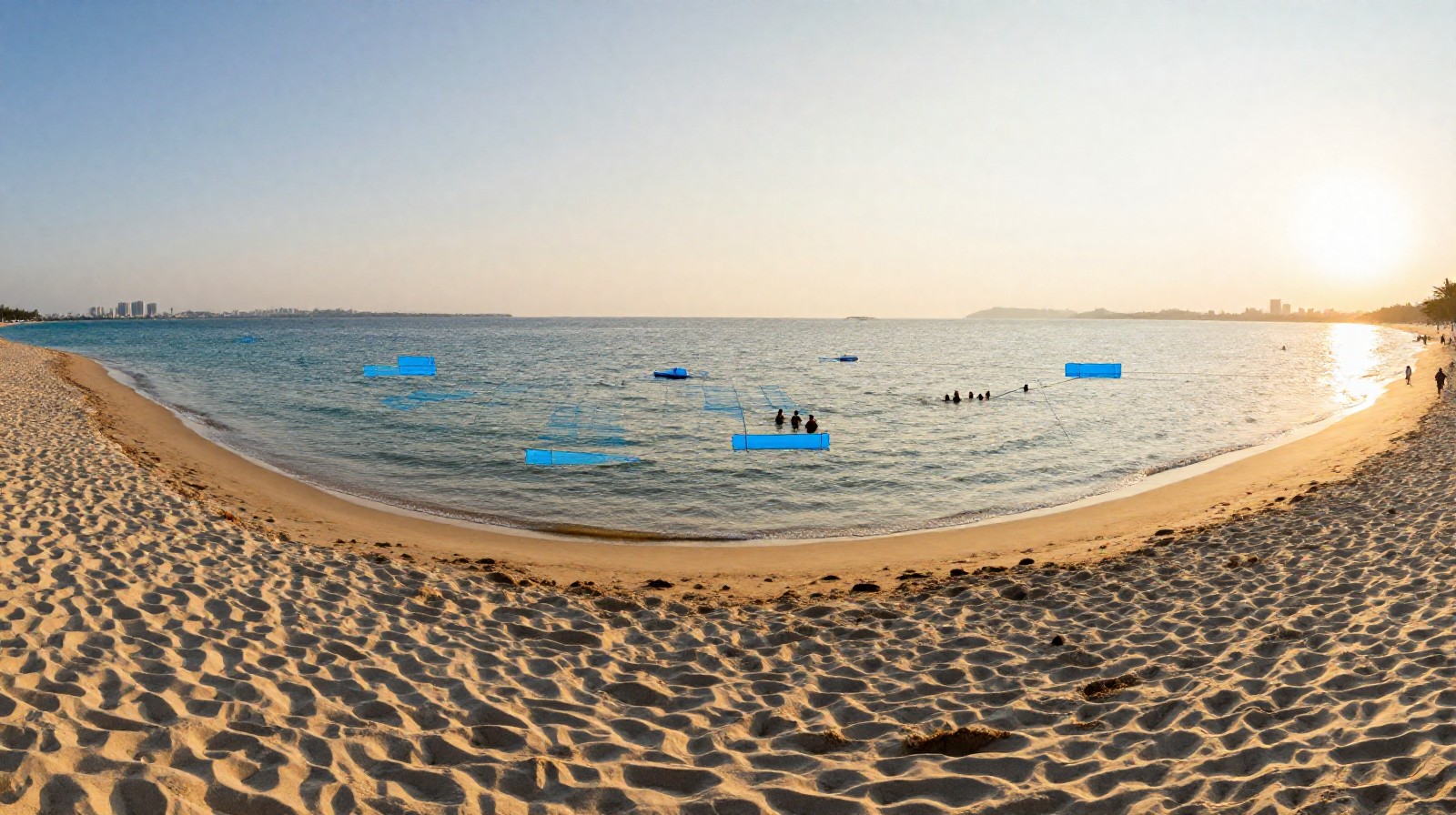 Tourists and locals swimming safely at a monitored beach in Qingdao during the summer evening