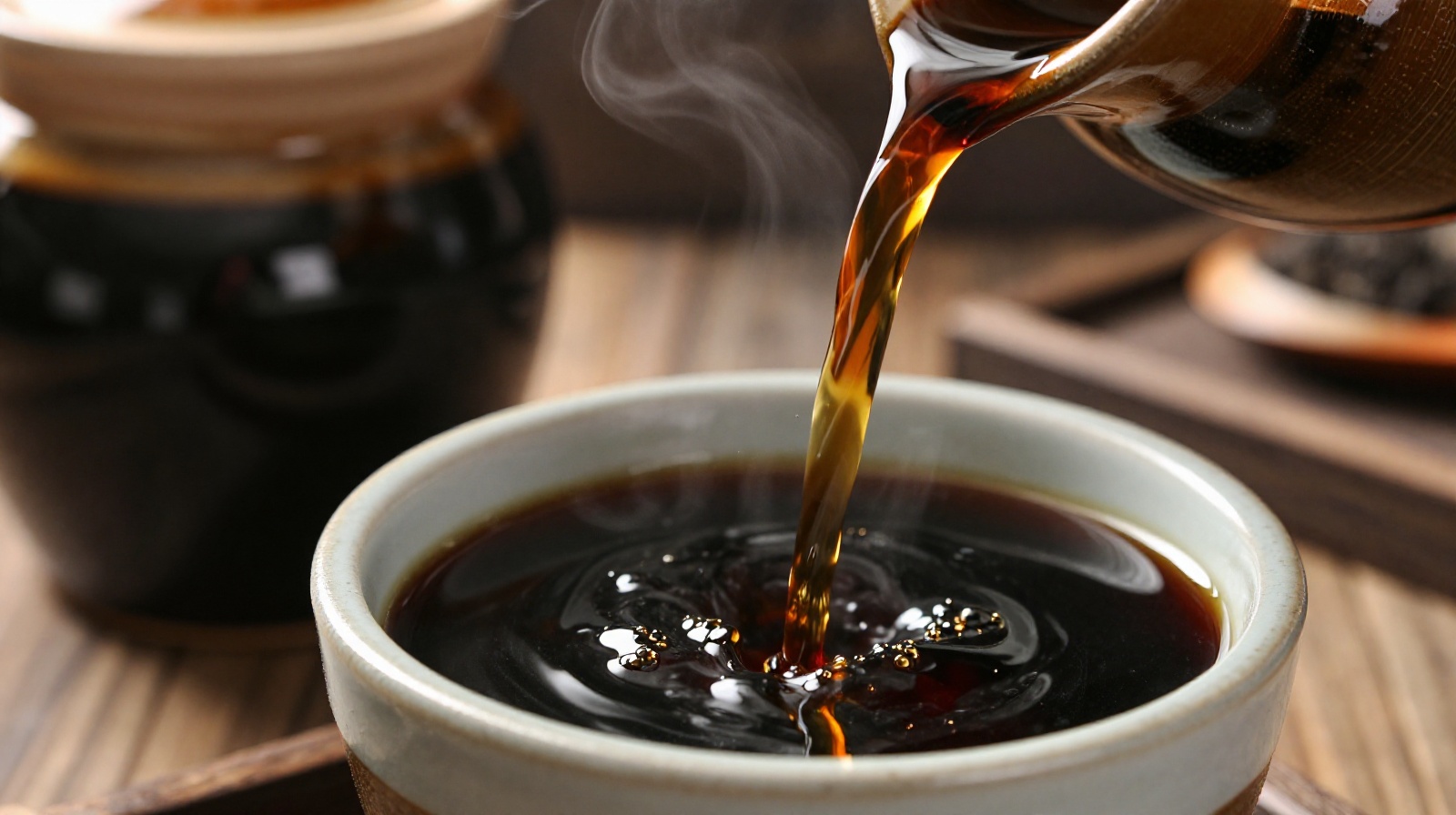 Dark brown Shanxi Mature Vinegar being poured from a traditional clay jar into a small ceramic bowl in a rustic Chinese kitchen setting