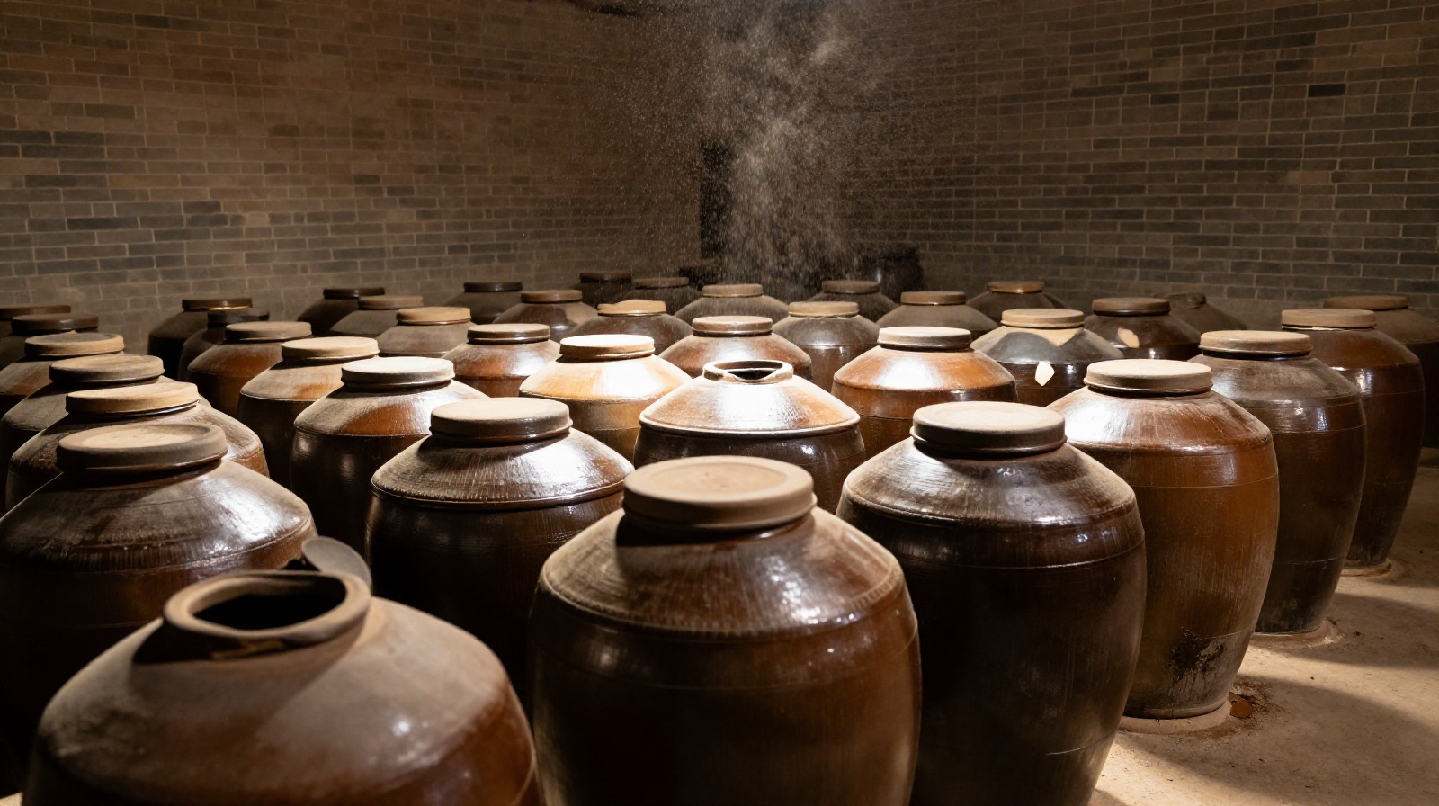 Traditional earthenware fermentation jars used for making aged grain vinegar in a Shanxi workshop