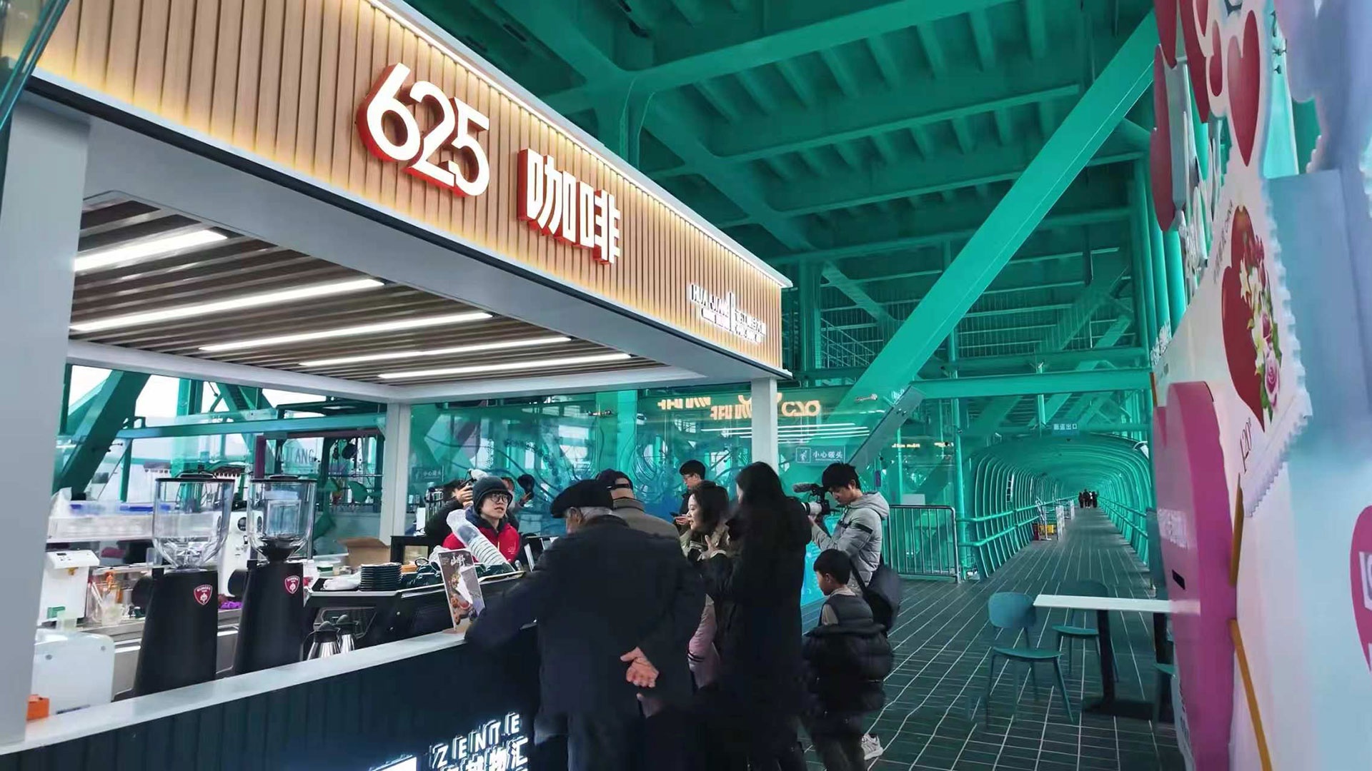Tourists dining in a service area cafe located high above the canyon on Huijiang Bridge