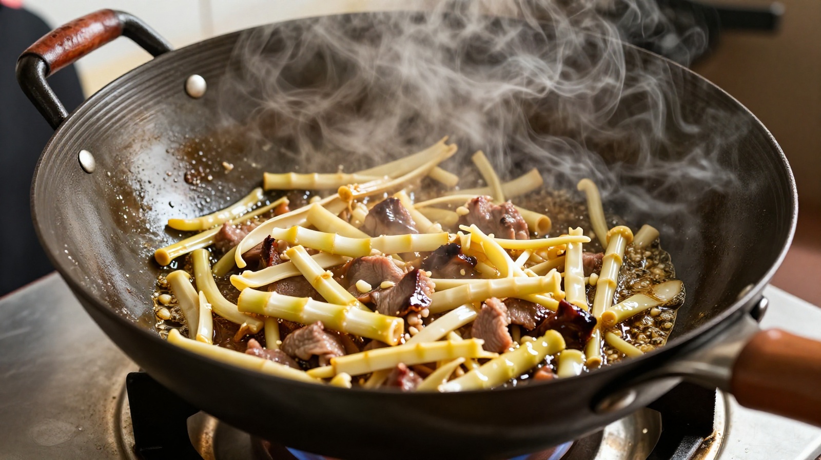 Chef stir-frying golden oil-braised bamboo shoots in a traditional Chinese wok