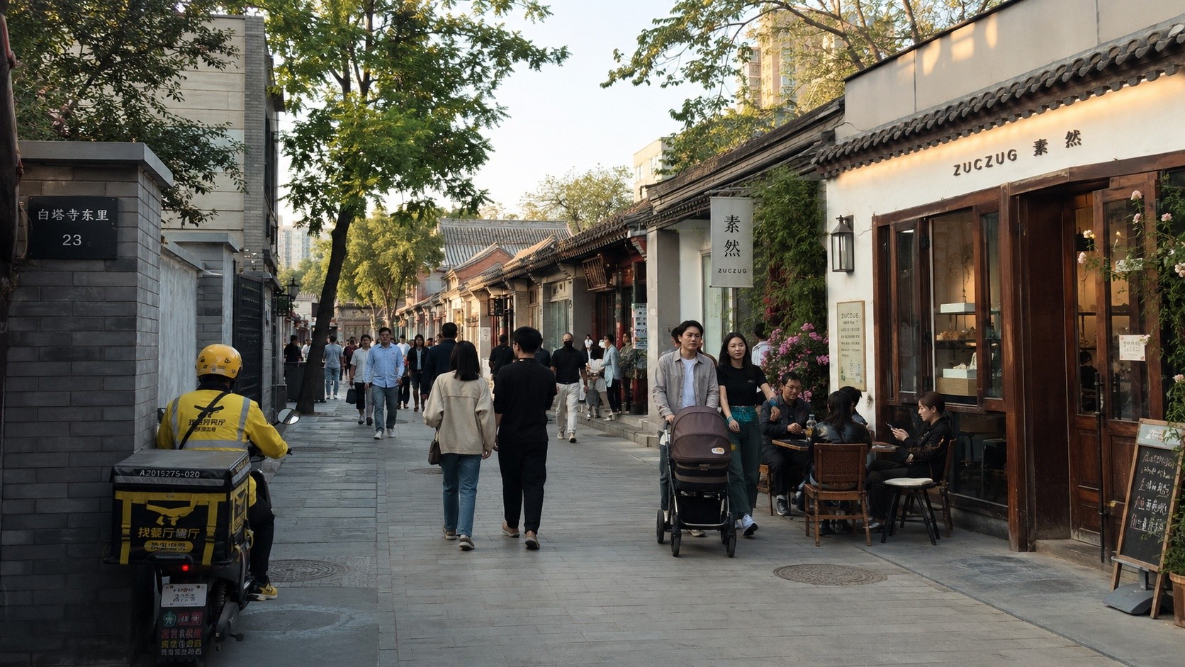 Modern and traditional architecture coexisting in a regenerated Chinese urban walking street with locals and visitors