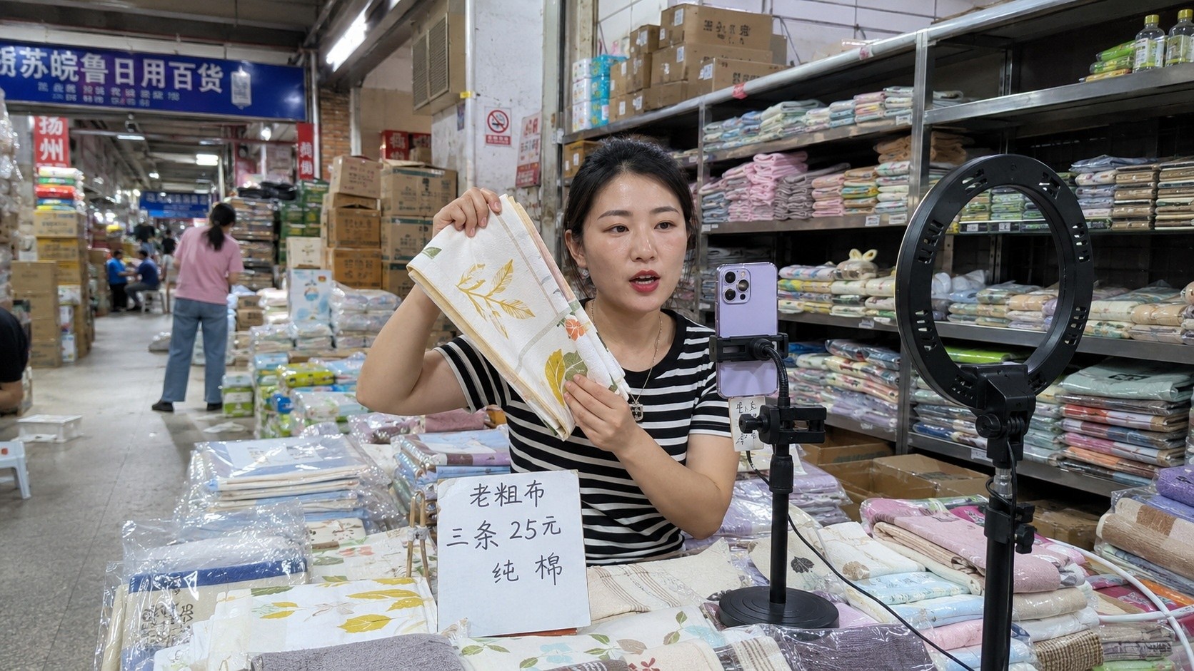 A local e-commerce host demonstrating product quality during a live stream in a Chinese wholesale market.