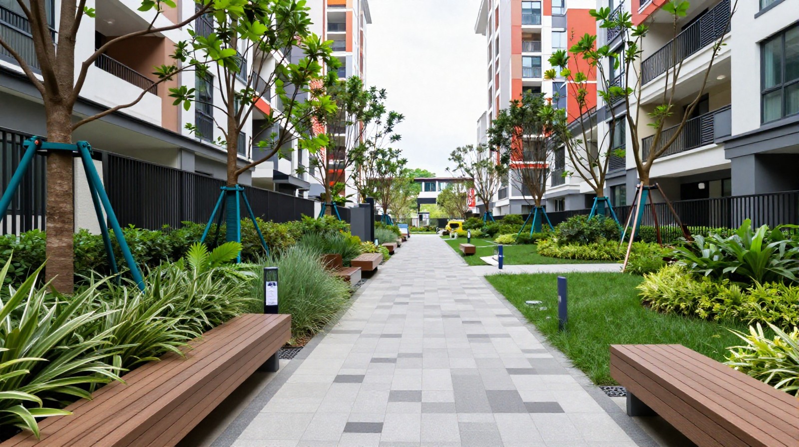 A newly created green corridor pocket park nestled between high-rise residential buildings in a dense Chinese city