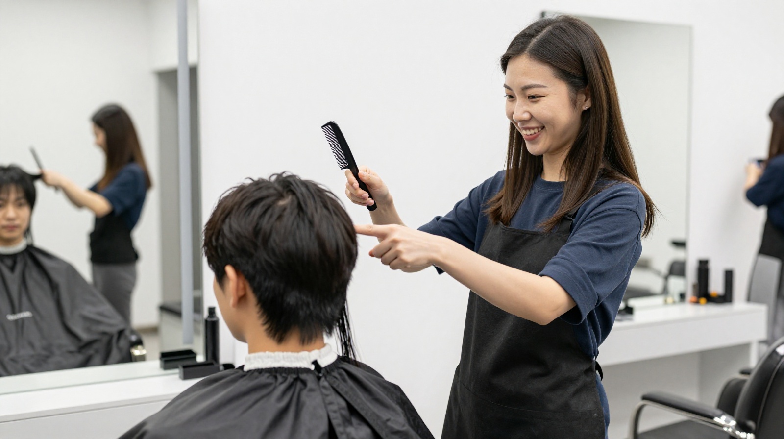 A hair stylist in China discussing haircut length options with a client before starting work.