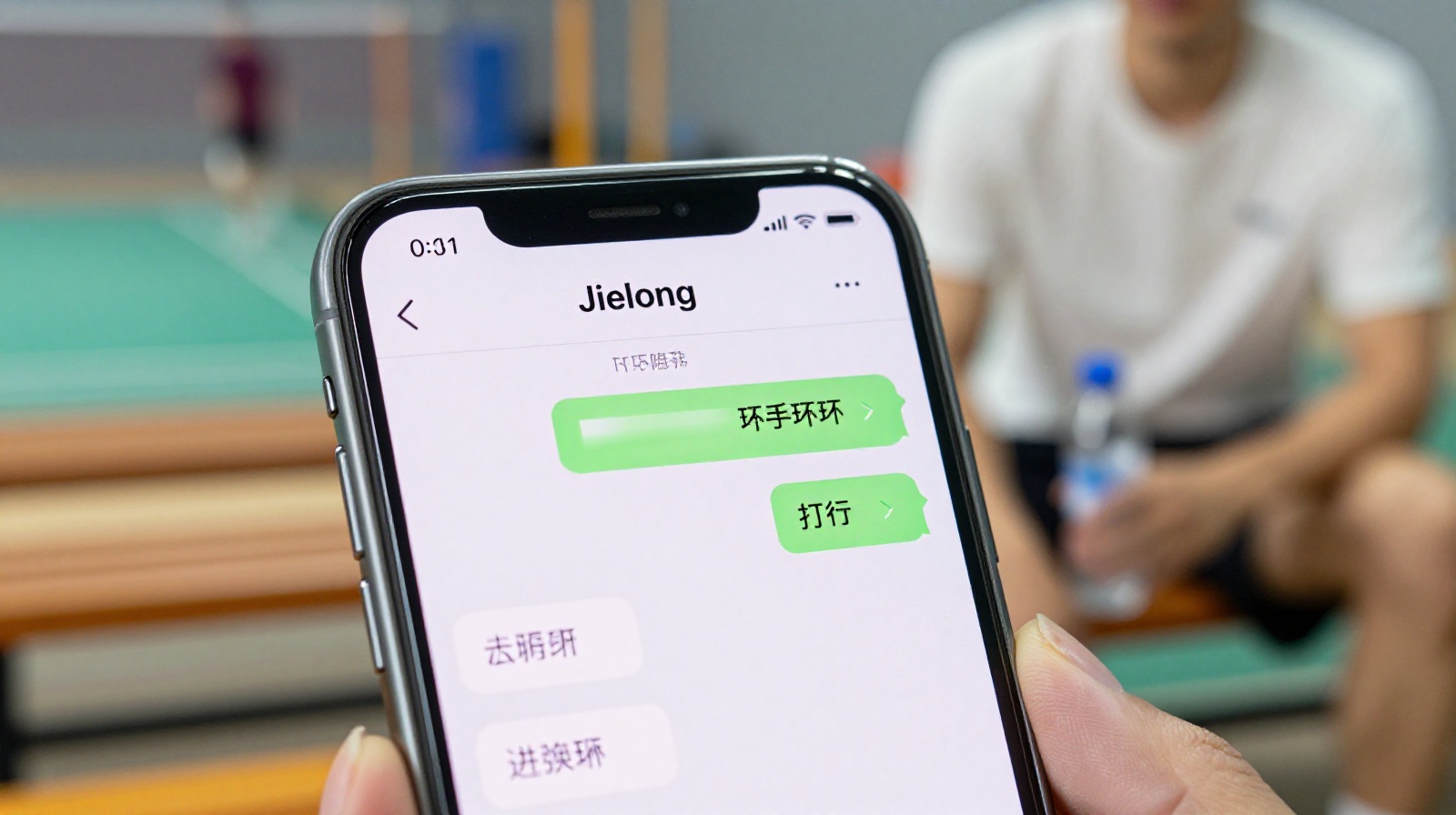 A close-up of a smartphone screen showing a WeChat group chat with a 'Jielong' sign-up list for a badminton game, held by a player resting in a gymnasium.