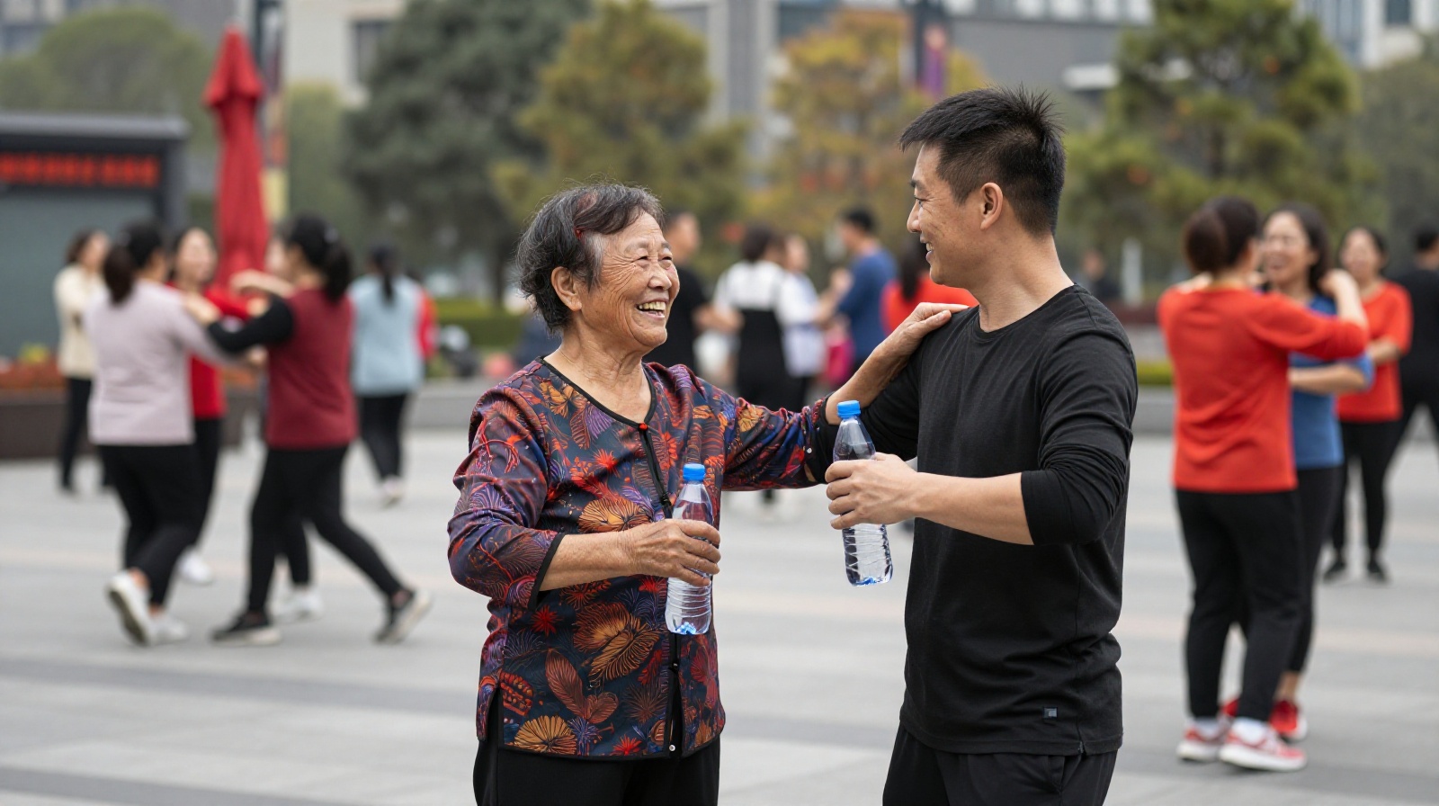 Intergenerational connection during a square dance break, highlighting social bonding.