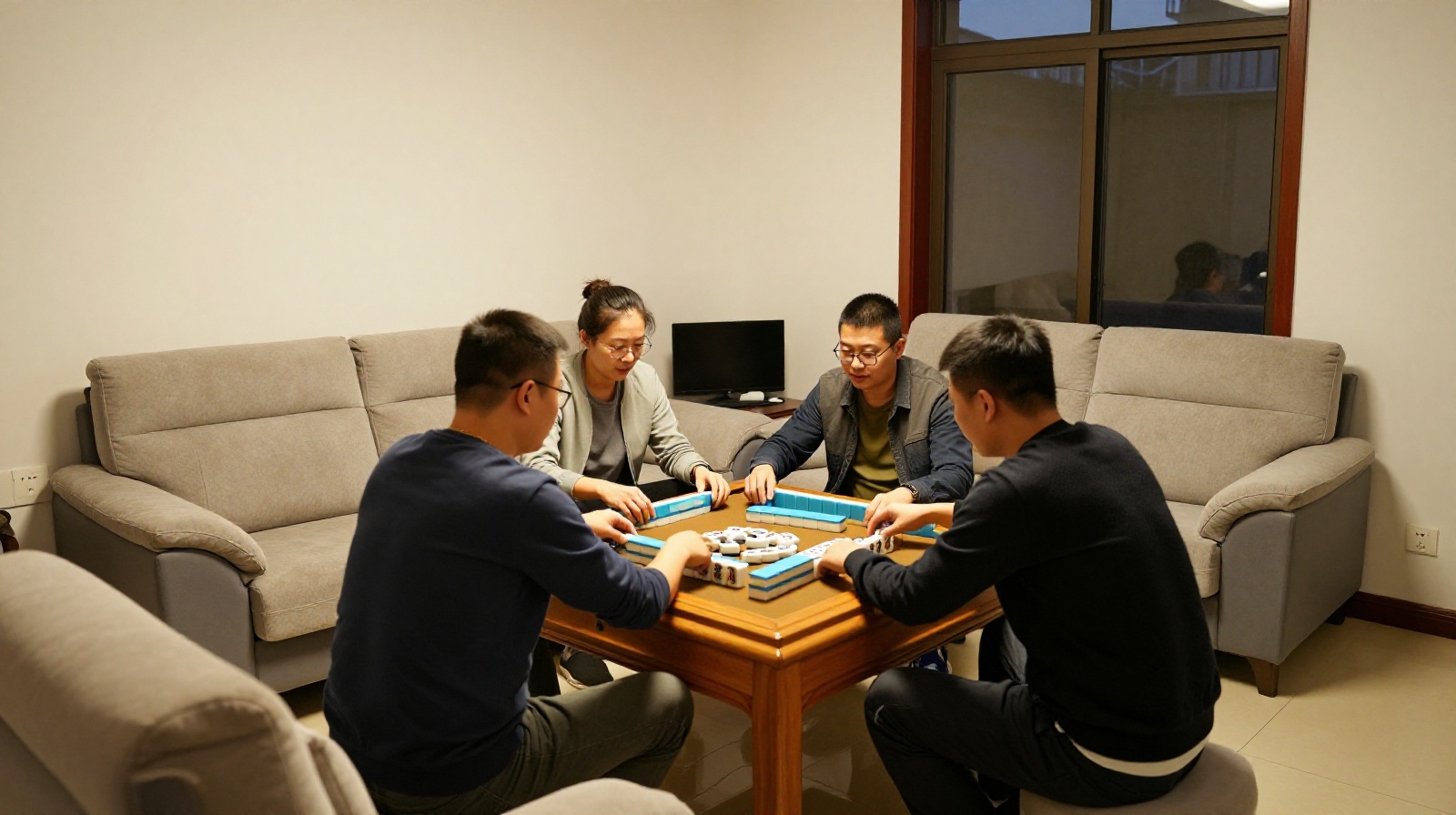 Four people playing mahjong together in a cozy living room setting