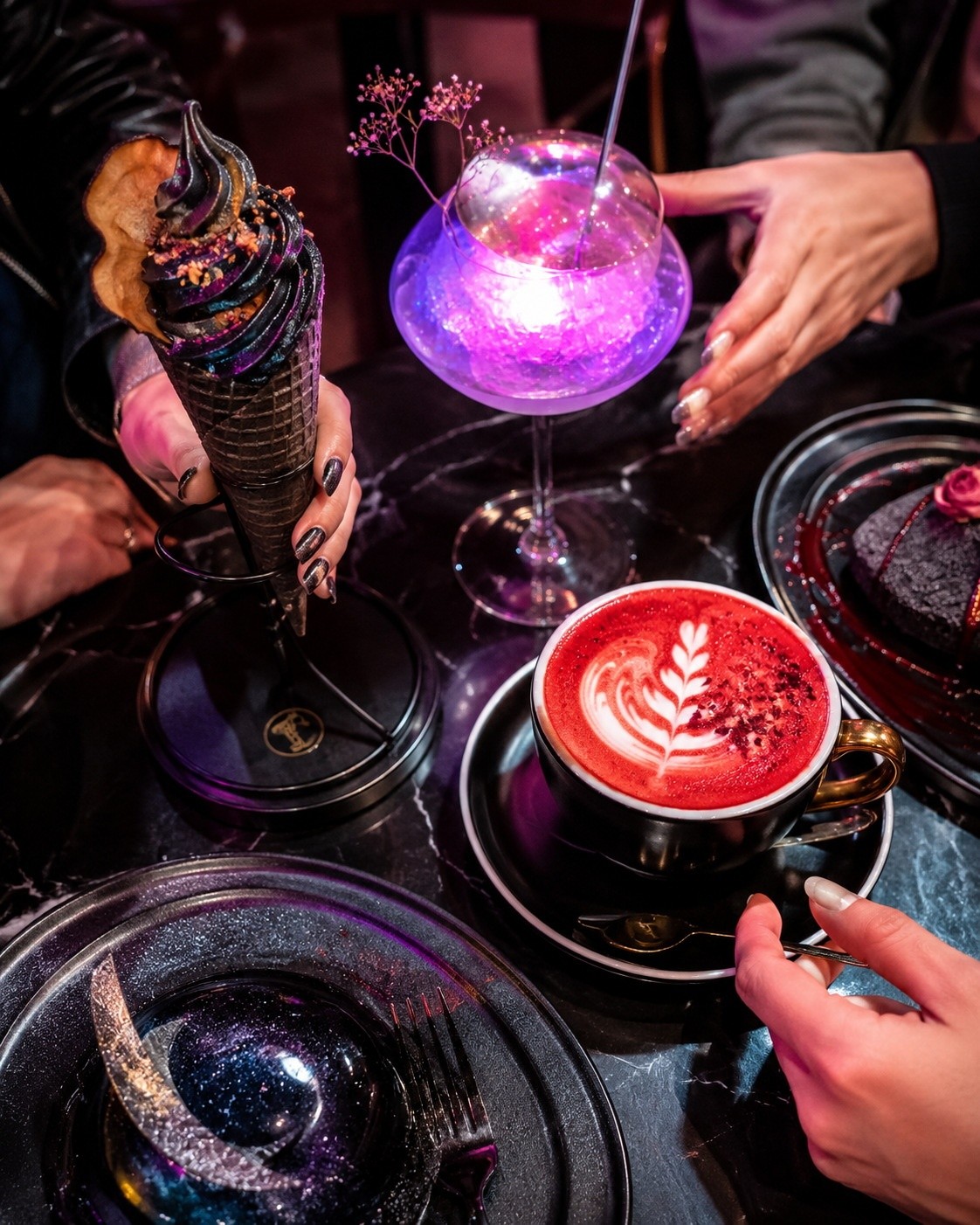 Close-up of colorful, unconventional food and drinks at a trendy Chinese cafe, highlighting the visual appeal of viral dining.