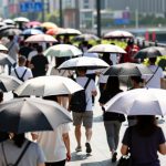 Umbrella Etiquette: Dancing Through Crowds Under the Summer Sun