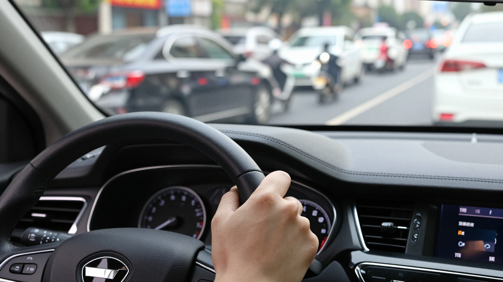 Driver's perspective inside a car on a busy Chinese street, showing dense traffic ahead.