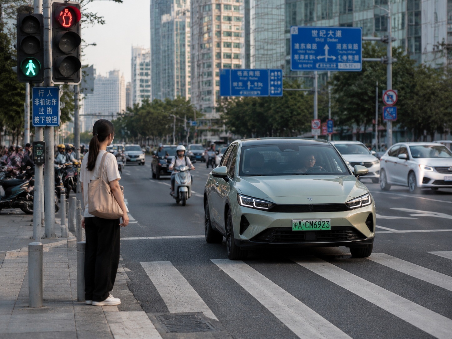 Pedestrian waiting to cross a street in China, with cars approaching cautiously.