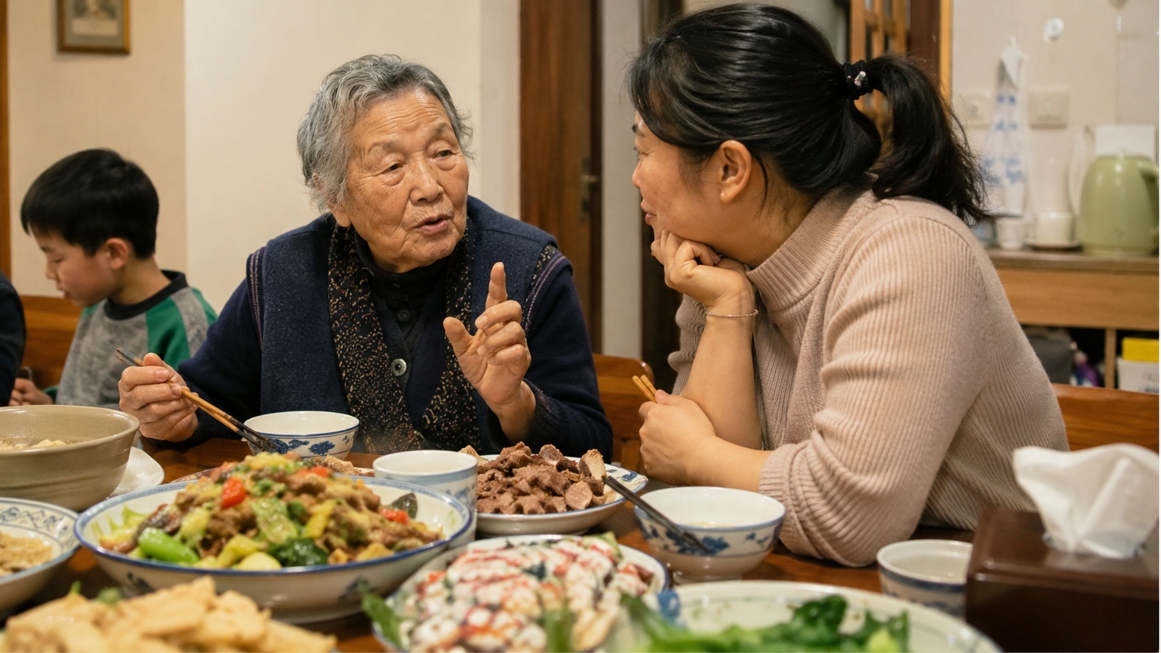 An elderly Chinese grandmother communicating with a young mother during a family meal, illustrating intergenerational parenting dynamics.
