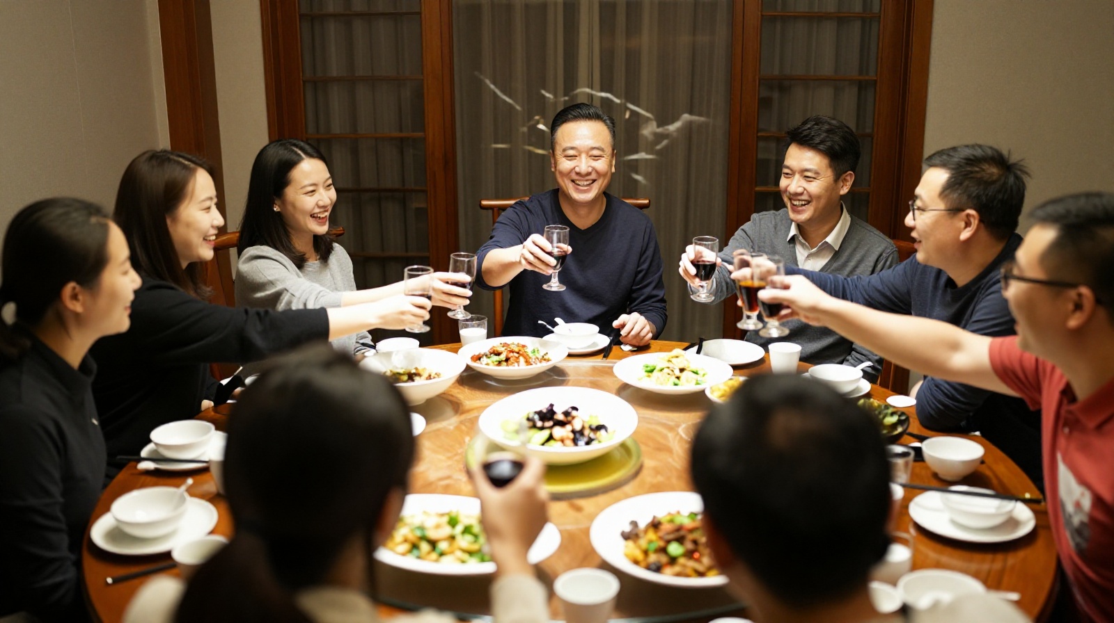 Colleagues enjoying a group dinner after work, demonstrating the role of social bonding in building professional relationships in China.