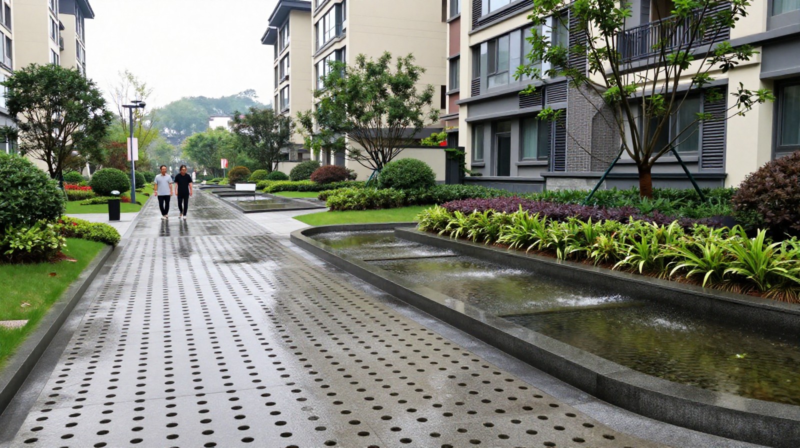 A rain garden in a Hangzhou residential district using permeable pavement to absorb stormwater, demonstrating sponge city urban planning concepts.