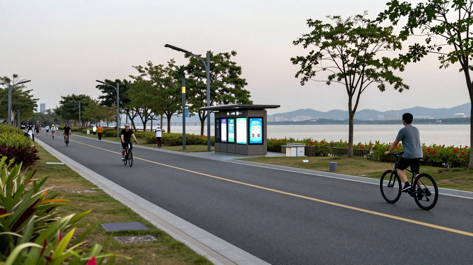 Evening scene at Shenzhen Bay Park where digital community kiosks blend into urban public space and recreational trails.