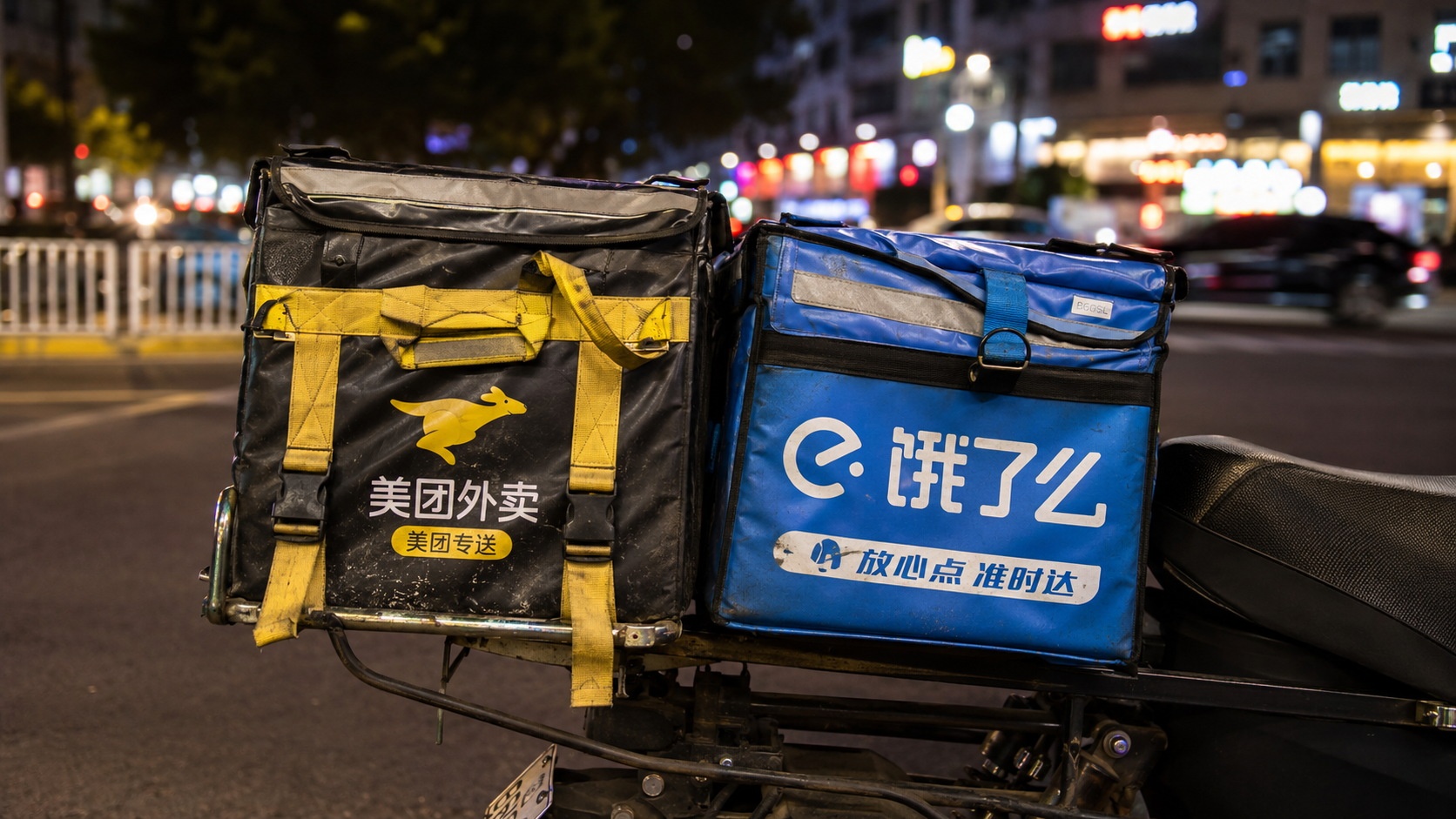 Close-up of insulated food delivery bags on a scooter in a Chinese city at night