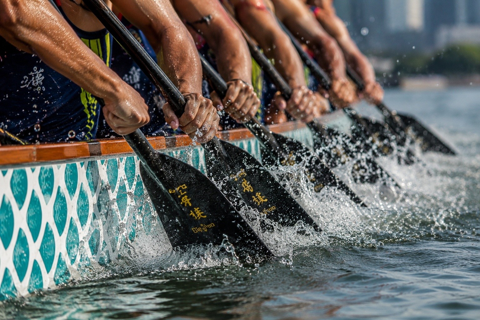 Close-up of synchronized dragon boat paddles striking the water during a race, showing athletic effort and teamwork.