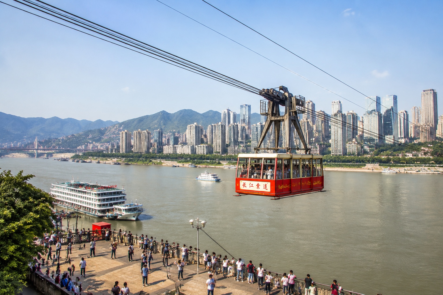 Yangtze River Cableway cable car crossing the river in Chongqing with the city skyline in the background.