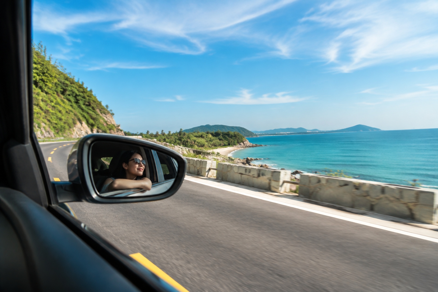 View from a car driving along the Hainan coastal tourist highway between Wenchang and Wanning, with the ocean on the right