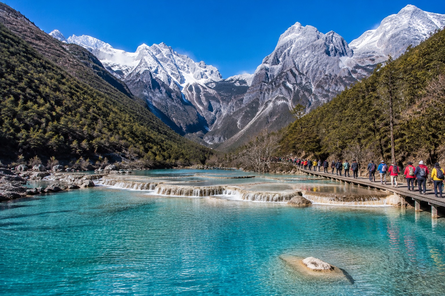 Blue Moon Valley with turquoise pools and Jade Dragon Snow Mountain in the background.