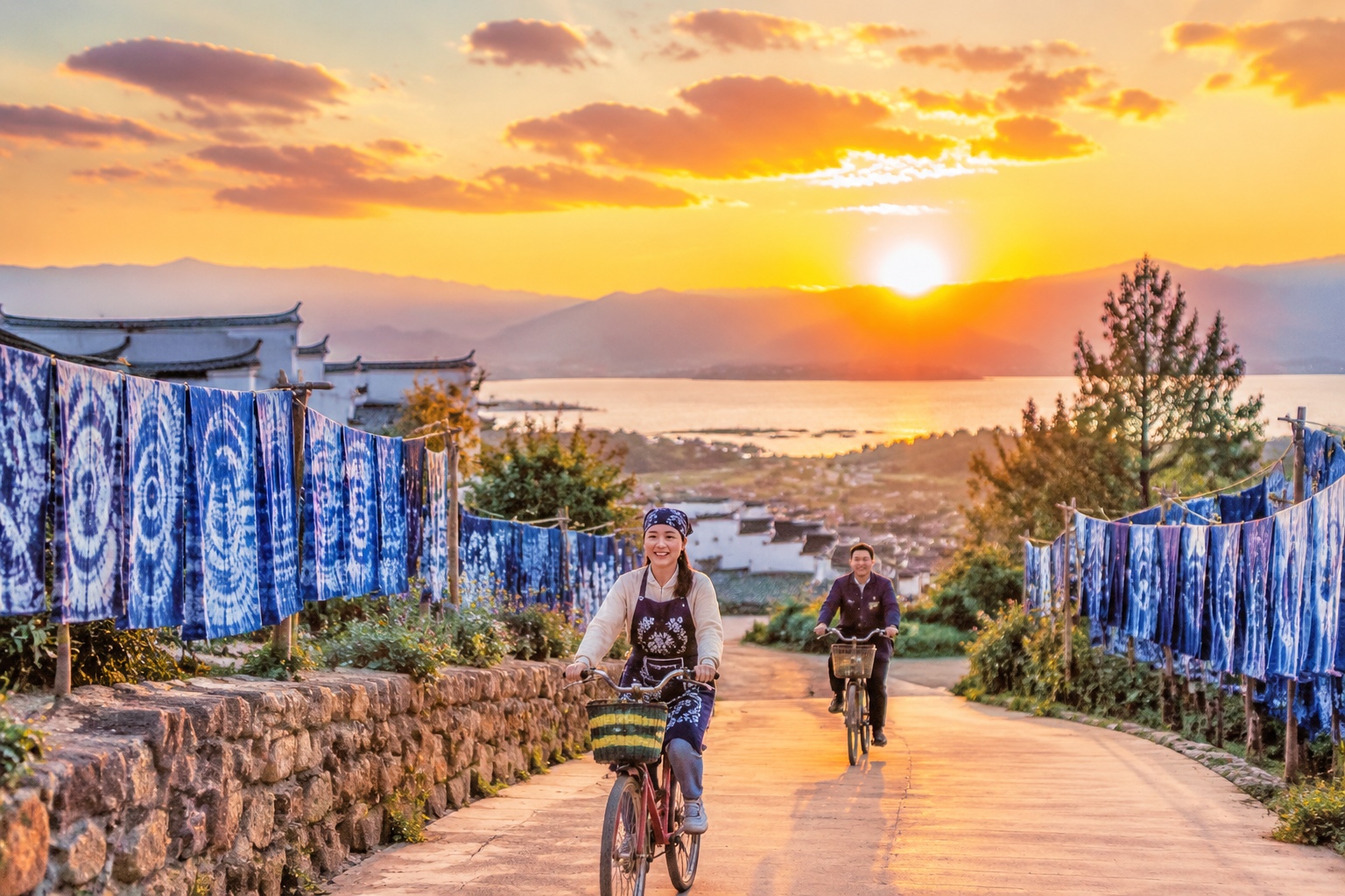 Sunset over tie-dye drying lines in Zhoucheng, Dali, Yunnan