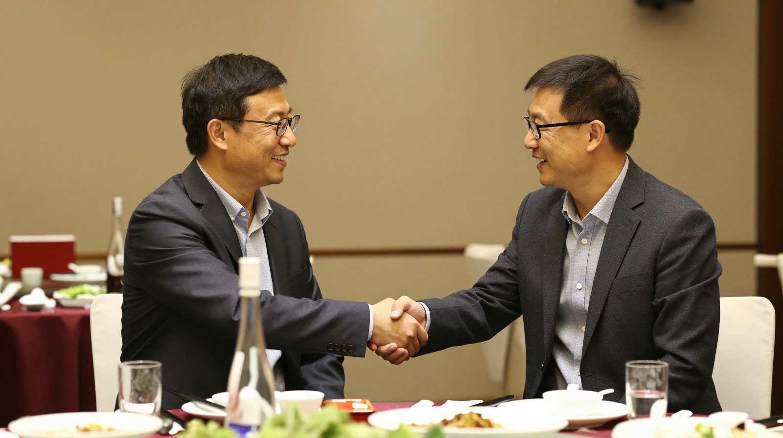 Businessmen shaking hands after a baijiu dinner, symbolizing a successful deal sealed through shared drinking ritual.