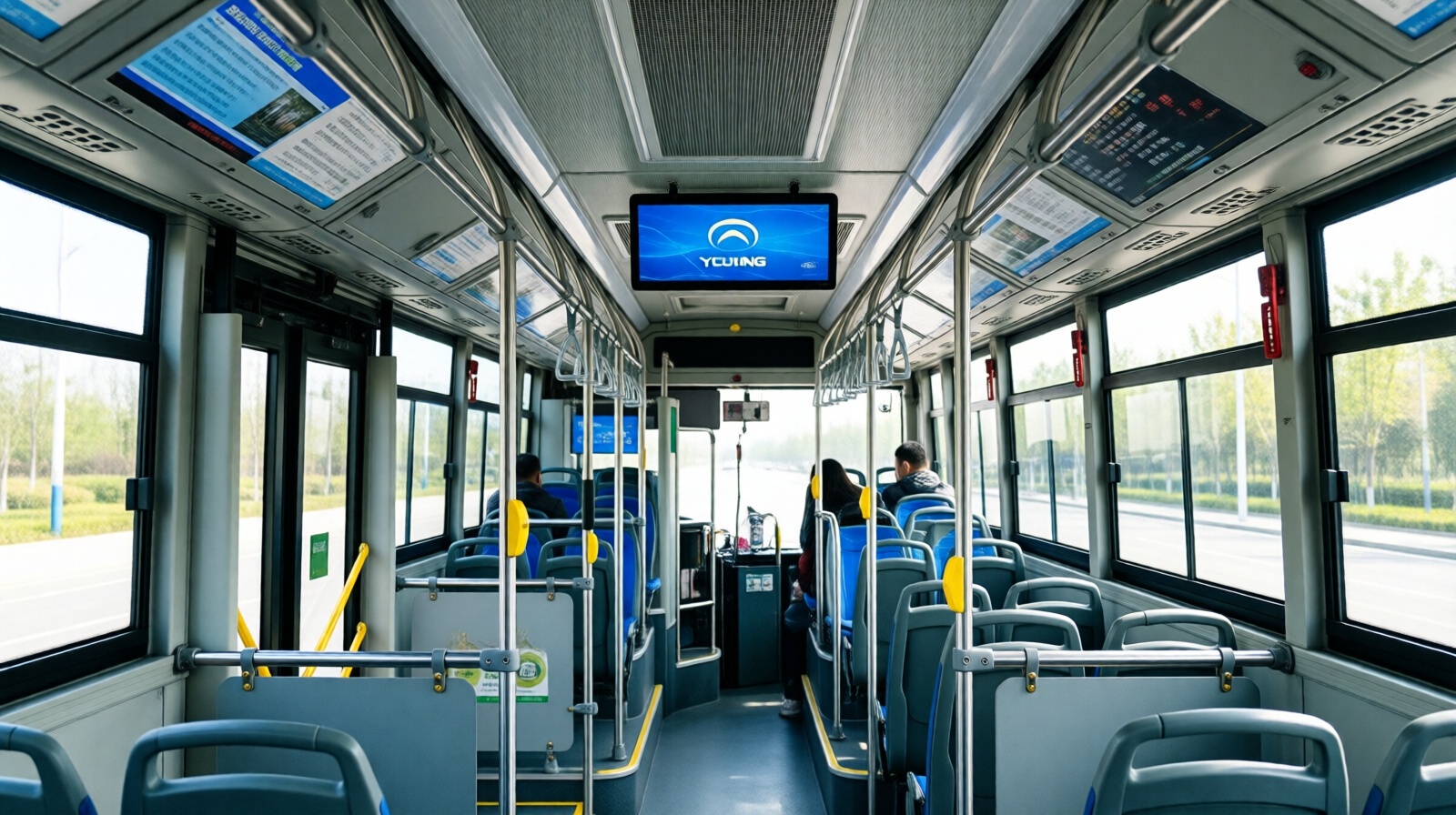 Interior of a Yutong electric bus in London with digital screens and passengers