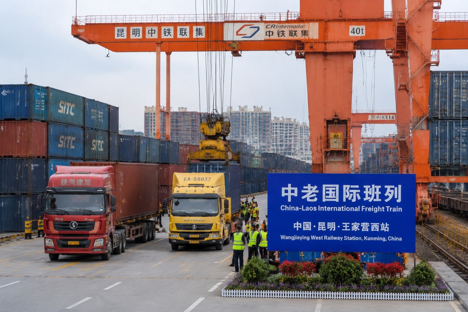 Aerial view of a container freight yard at the China-Laos Railway terminal in Kunming, showing stacked shipping containers and cranes