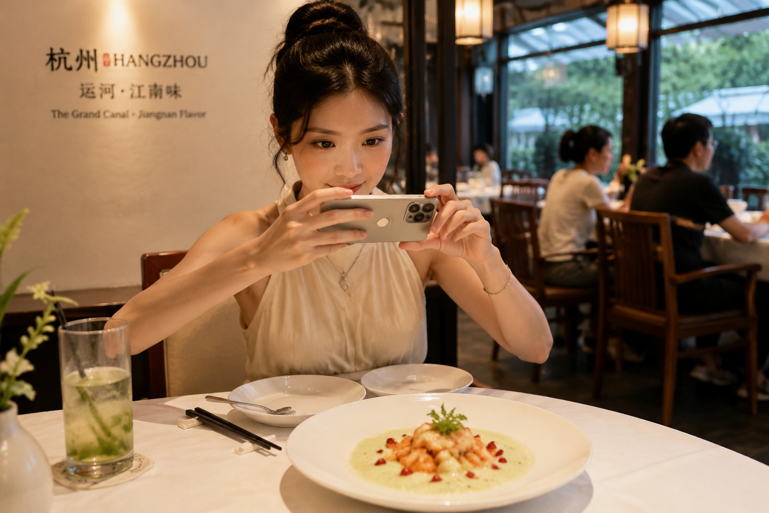 Young diners photographing a modern Zhejiang dish in a Hangzhou restaurant at night
