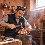 In Kashgar's Old City, a Uyghur Craftsman Hammers a Copper Pot into a Thousand Years of Echoes